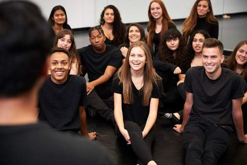 teacher-at-performing-arts-school-talking-to-stude-2021-08-26-16-13-31-utc